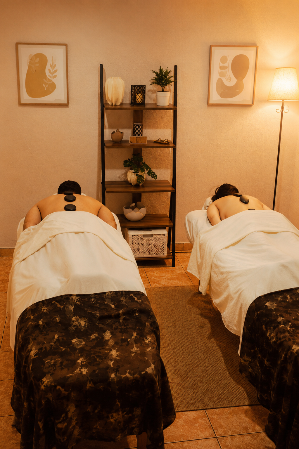 Couple receiving a hot stone massage in an intimate room